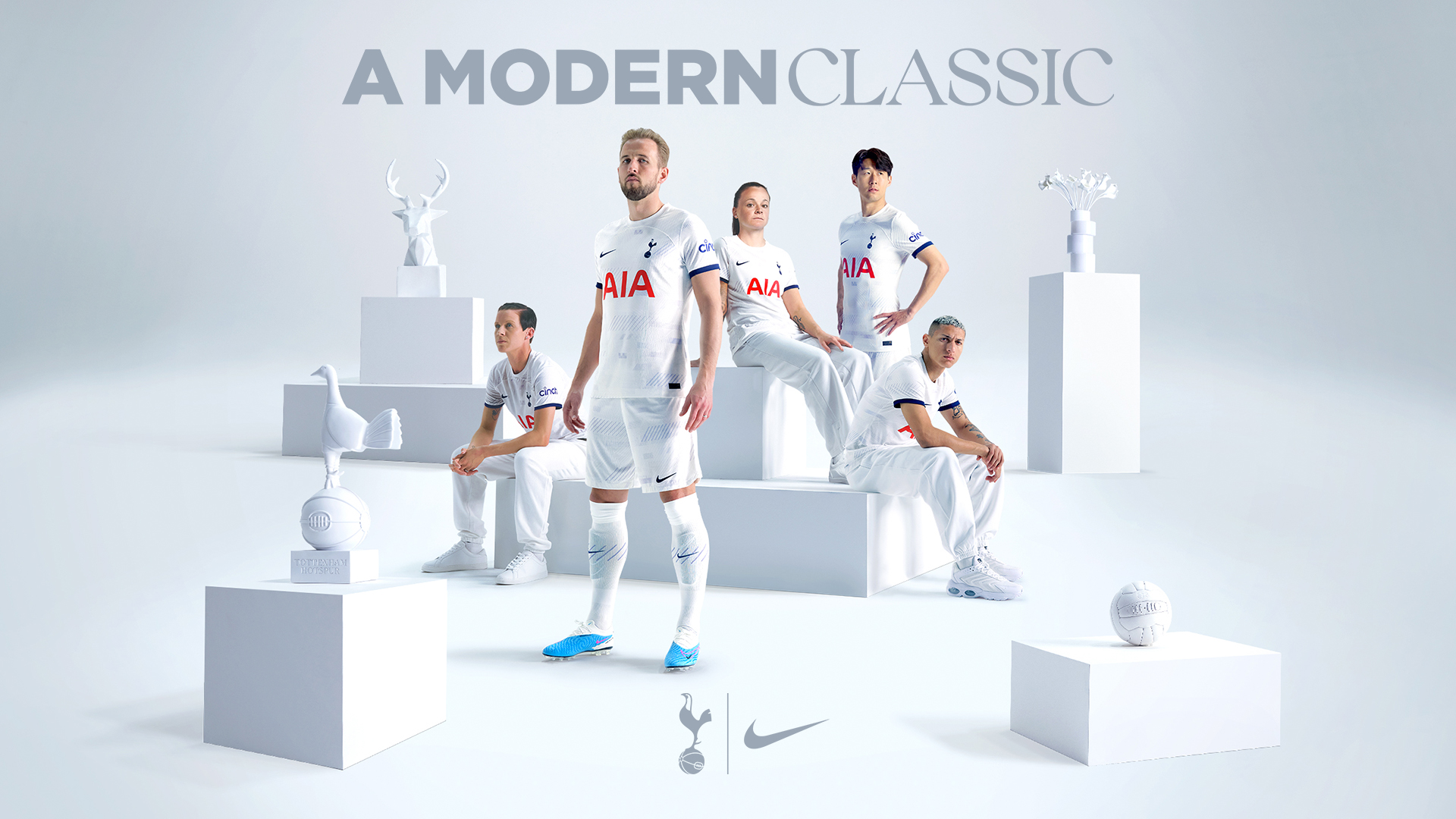 Tottenham Hotspurs players standing in a white gallery backdrop with various white props
