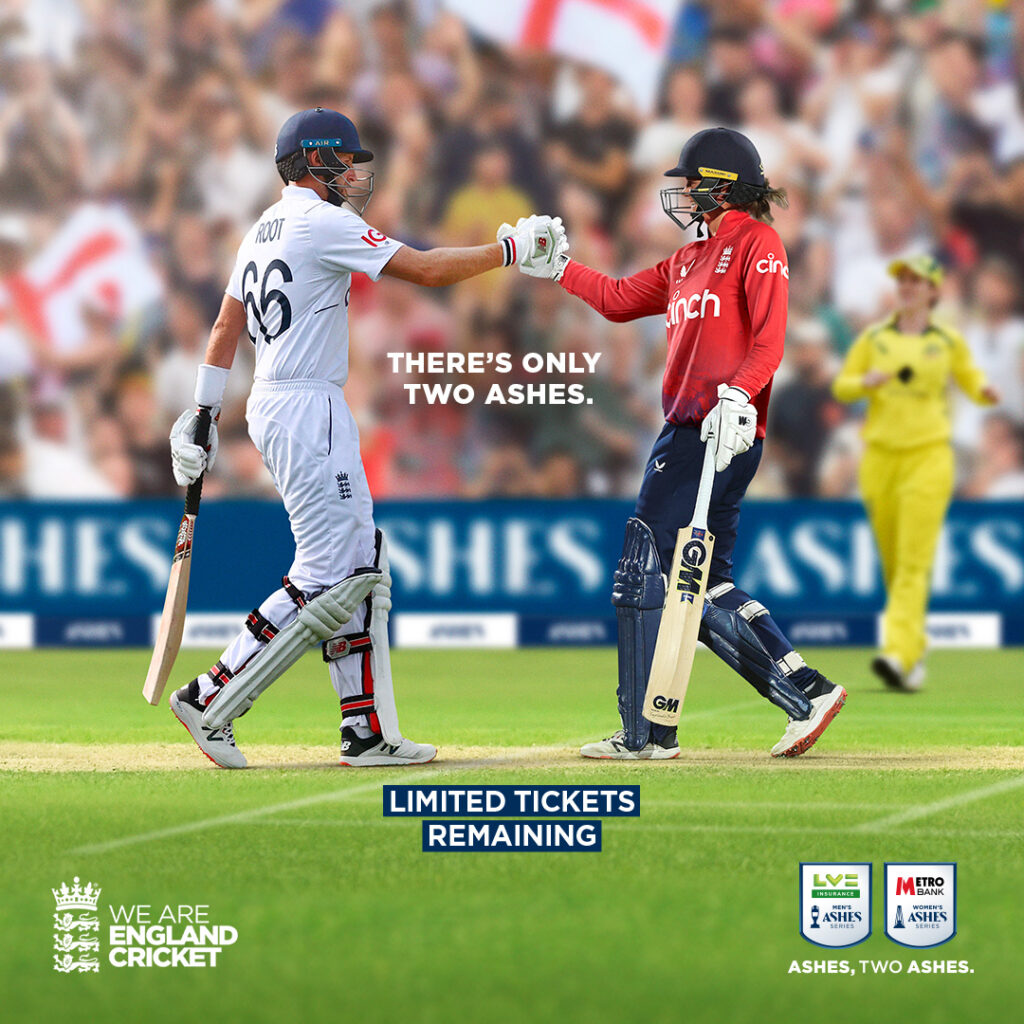 Joe Root and Nat Sciver-Brunt shaking hands on a cricket pitch, with an Australian player in the background, in front of a crowd holding England flags