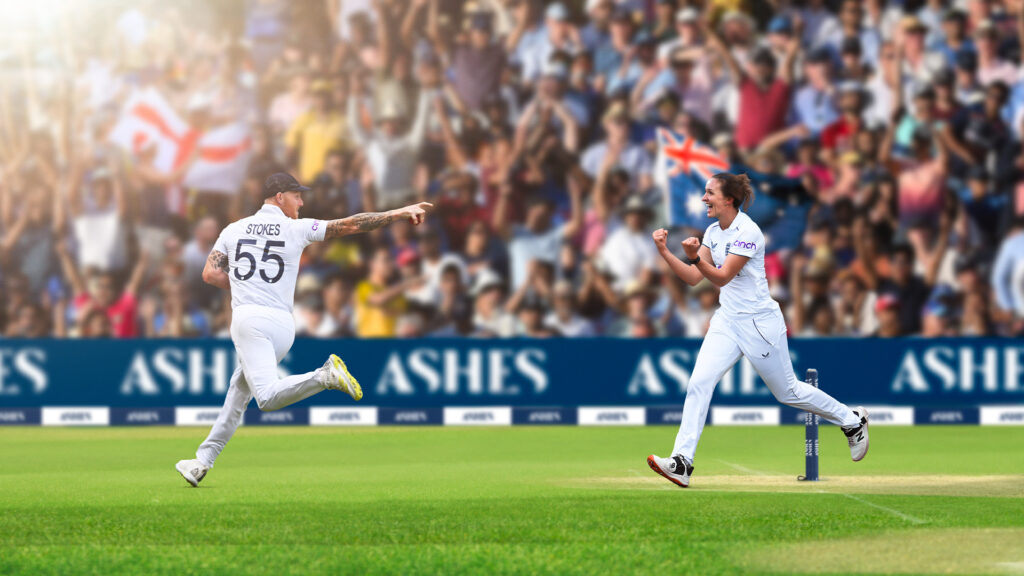 Ben Stokes and Kate Cross celebrating on a cricket pitch in front of a crowd holding England and Australian flags