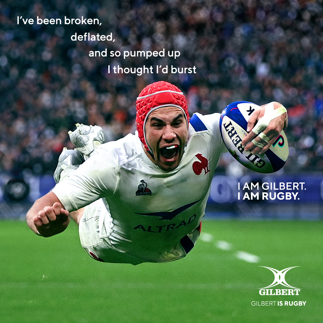 Gabin Villière celebrating while diving to score a try for France during the Six Nations in 2022. A headline reads: “I’ve been broken, deflated, and so pumped up I thought I’d burst. I am Gilbert. I am Rugby.”
