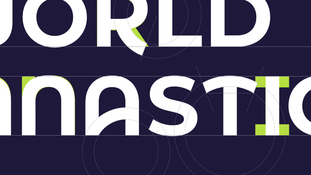 Close up of the World Gymnastic Logo showing the typography blueprint of white copy on navy background